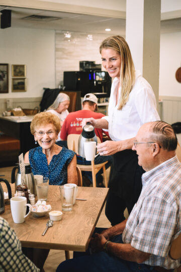 Server pouring coffee