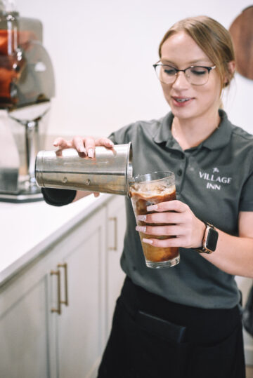Village Inn franchise employee pouring coffee